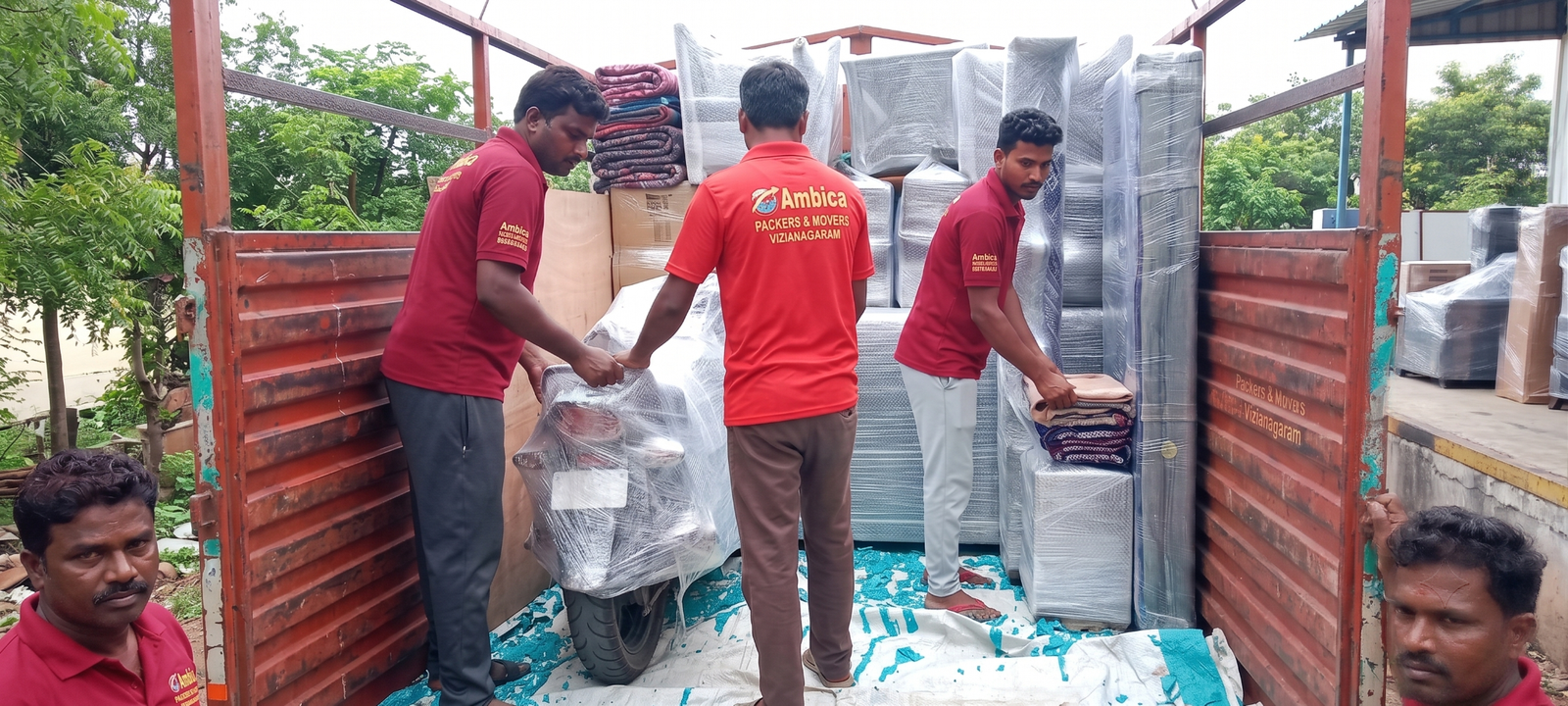 Couple surrounded by moving boxes settling into their new home